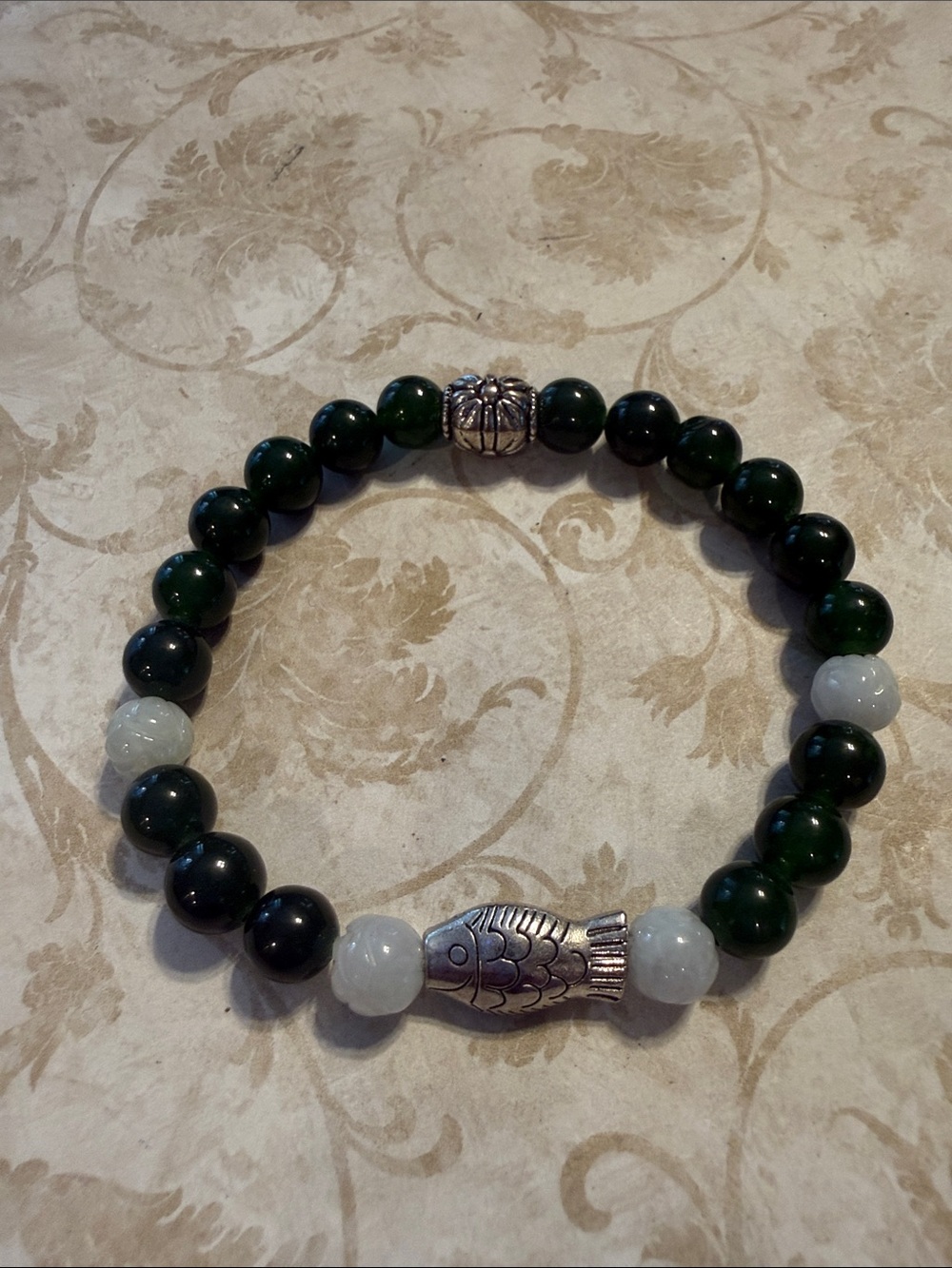 Green and White Beaded Bracelet with Silver Fish Charm